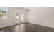 Spacious living room features hardwood floors, natural light, and backyard access at 100 Silver Moon Dr, Loganville, GA 30052