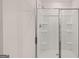 Modern bathroom features a shower with glass doors and built in shelves at 100 Silver Moon Dr, Loganville, GA 30052