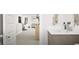 Well-lit bathroom featuring modern fixtures and a view into the living area at 799 Grande Bishop Dr, Fairburn, GA 30213