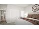 Comfortable bedroom with neutral tones, patterned bedding, and an elegant, decorative wall mirror at 799 Grande Bishop Dr, Fairburn, GA 30213