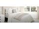 Bright bedroom featuring a large window and luxurious bedding at 799 Grande Bishop Dr, Fairburn, GA 30213