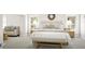 Inviting bedroom with a cushioned headboard, decorative pillows, bench, and side tables with lamps at 799 Grande Bishop Dr, Fairburn, GA 30213