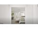 View of the bedroom with a ceiling fan, stylish decor, and a seating area at 799 Grande Bishop Dr, Fairburn, GA 30213