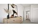 Bright bedroom featuring stylish dresser with modern art piece, adding a touch of sophistication at 799 Grande Bishop Dr, Fairburn, GA 30213