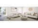 Bright living room with comfortable seating, natural light, and stylish decor at 799 Grande Bishop Dr, Fairburn, GA 30213