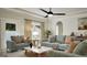 Cozy living room with comfortable seating, ceiling fan, and a bright, neutral color palette at 799 Grande Bishop Dr, Fairburn, GA 30213