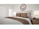 Serene main bedroom featuring plush bedding, neutral decor, and abundant natural light at 799 Grande Bishop Dr, Fairburn, GA 30213