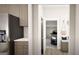 Mudroom featuring bench seating, storage, and direct access to a sleek, modern garage at 799 Grande Bishop Dr, Fairburn, GA 30213