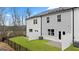 Beautiful backyards featuring green grass, white fences, and privacy in the townhome complex at 322 Sound Cir # 118, Stockbridge, GA 30281