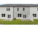 Townhome backyard view with a new sod lawn and privacy fences at 322 Sound Cir # 118, Stockbridge, GA 30281