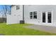 Townhome backyard features a grass lawn and patio at 322 Sound Cir # 118, Stockbridge, GA 30281