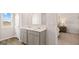 Bathroom showcasing double sinks, modern fixtures, and serene ambiance at 322 Sound Cir # 118, Stockbridge, GA 30281