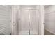 Bathroom highlighting a glass-enclosed shower with modern fixtures and a sleek tile surround at 322 Sound Cir # 118, Stockbridge, GA 30281