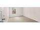 Bedroom view with a window and neutral carpeting and walls at 322 Sound Cir # 118, Stockbridge, GA 30281