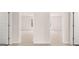 View of multiple bedrooms featuring neutral carpeting and walls at 322 Sound Cir # 118, Stockbridge, GA 30281