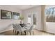 Bright dining room with modern chairs and a view of the backyard at 322 Sound Cir # 118, Stockbridge, GA 30281