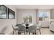 Cozy dining room with a round table, comfortable chairs, and natural light at 322 Sound Cir # 118, Stockbridge, GA 30281