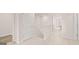 A brightly lit hallway with white walls and neutral carpeting leads to the rooms upstairs at 322 Sound Cir # 118, Stockbridge, GA 30281