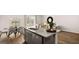 Open kitchen and dining area, featuring granite countertops and stainless steel dishwasher at 322 Sound Cir # 118, Stockbridge, GA 30281
