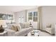 Comfortable living area with soft, neutral-toned furniture, large windows, and natural light at 322 Sound Cir # 118, Stockbridge, GA 30281