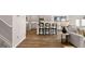 Open living space blending the kitchen, dining and living room with luxury vinyl flooring at 322 Sound Cir # 118, Stockbridge, GA 30281