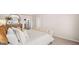 A serene main bedroom featuring a plush upholstered bed, soft lighting, and calming neutral colors at 322 Sound Cir # 118, Stockbridge, GA 30281