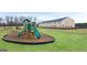 Community playground with a slide and swings in front of the newly constructed townhomes at 322 Sound Cir # 118, Stockbridge, GA 30281