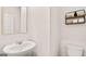 A contemporary powder room featuring a sleek vanity, modern fixtures, and minimalist decor at 322 Sound Cir # 118, Stockbridge, GA 30281