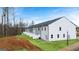 Rear view of new townhome construction with fences and landscaping at 322 Sound Cir # 118, Stockbridge, GA 30281