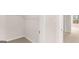 A walk-in closet with shelving and neutral carpeting is adjacent to the bedroom at 322 Sound Cir # 118, Stockbridge, GA 30281
