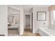 Bright bathroom featuring a soaking tub, framed art and a view into the bedroom at 326 Sound Cir # 119, Stockbridge, GA 30281
