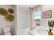 Well-lit bathroom with double vanity, tub, and stylish decor offering a fresh and comfortable feel at 326 Sound Cir # 119, Stockbridge, GA 30281