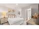 Bright bedroom with a double bed, nightstand, decor, and bathroom access at 326 Sound Cir # 119, Stockbridge, GA 30281