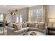 Comfortable living room featuring a sectional sofa, area rug, and view to the outside at 326 Sound Cir # 119, Stockbridge, GA 30281