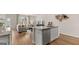 A Kitchen island, stainless steel dishwasher and view of the living room with natural light at 326 Sound Cir # 119, Stockbridge, GA 30281