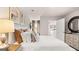 Spacious bedroom boasts large bed, neutral tones, plush bedding, carpeted floors, and decor at 326 Sound Cir # 119, Stockbridge, GA 30281