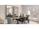 Dining room featuring modern table set and mirrors at 326 Sound Cir # 119, Stockbridge, GA 30281
