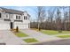 Charming home with a two-car garage, manicured lawn, and a long concrete driveway at 326 Sound Cir # 119, Stockbridge, GA 30281