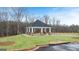 Community gazebo with stone columns nestled in a landscaped green space at 326 Sound Cir # 119, Stockbridge, GA 30281