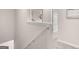 Bright hallway features neutral paint, carpet, and stairway to the lower level of the home at 326 Sound Cir # 119, Stockbridge, GA 30281