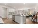 Spacious kitchen featuring an island, stainless appliances, and an open layout to living area at 326 Sound Cir # 119, Stockbridge, GA 30281