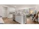 Open-concept kitchen with a large island, stainless steel appliances, and views of the living area at 326 Sound Cir # 119, Stockbridge, GA 30281