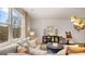 Bright living room with large windows, plush sofa, and stylish decor at 326 Sound Cir # 119, Stockbridge, GA 30281
