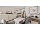 Open-concept living space with modern furnishings, dining area, and kitchen in the background at 326 Sound Cir # 119, Stockbridge, GA 30281