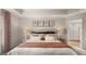 Comfortable main bedroom with a tray ceiling, neutral decor, and an en-suite bathroom at 326 Sound Cir # 119, Stockbridge, GA 30281