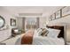 Serene bedroom with neutral color scheme, tray ceilings, and ample natural light at 326 Sound Cir # 119, Stockbridge, GA 30281