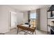 Inviting home office featuring a modern desk, comfortable seating, and natural light from the window at 326 Sound Cir # 119, Stockbridge, GA 30281