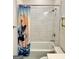 Bathroom features a tiled shower/tub and unique shower curtain at 4438 Encore Park Xing, Duluth, GA 30097