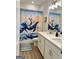 Bathroom features a double sink vanity and unique shower curtain at 4438 Encore Park Xing, Duluth, GA 30097