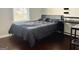 Bedroom with a black bed, a desk, and a window at 4438 Encore Park Xing, Duluth, GA 30097